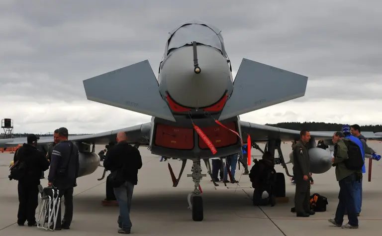 Visitors at the Spangdahlem Air Base Open House look at a Eurofighter Typhoon aircraft July 30, 2011, at the base in Germany 110730-F-RC891-010