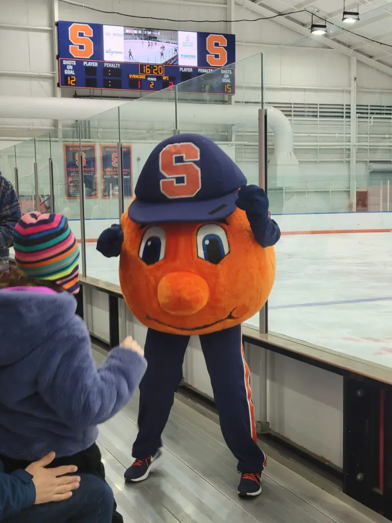 Otto the Orange entertains the audience at Syracuse women's ice hockey game against Rensselaer Polytechnic Institute at the Tennity Ice Skating Pavilion, Syracuse University 16
