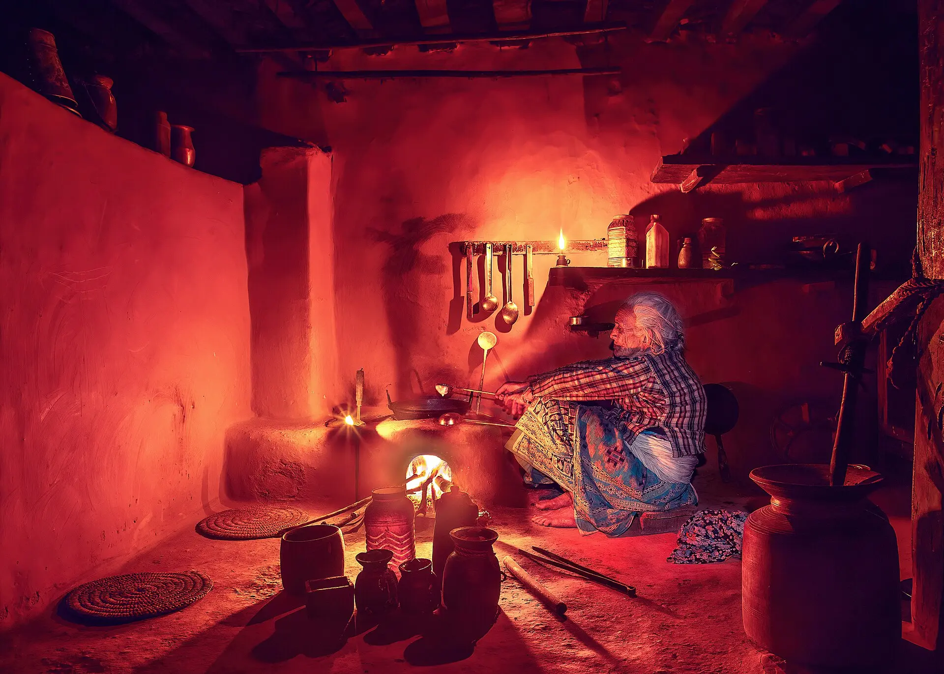 Grandmother preparing food inside traditional kitchen (edited)